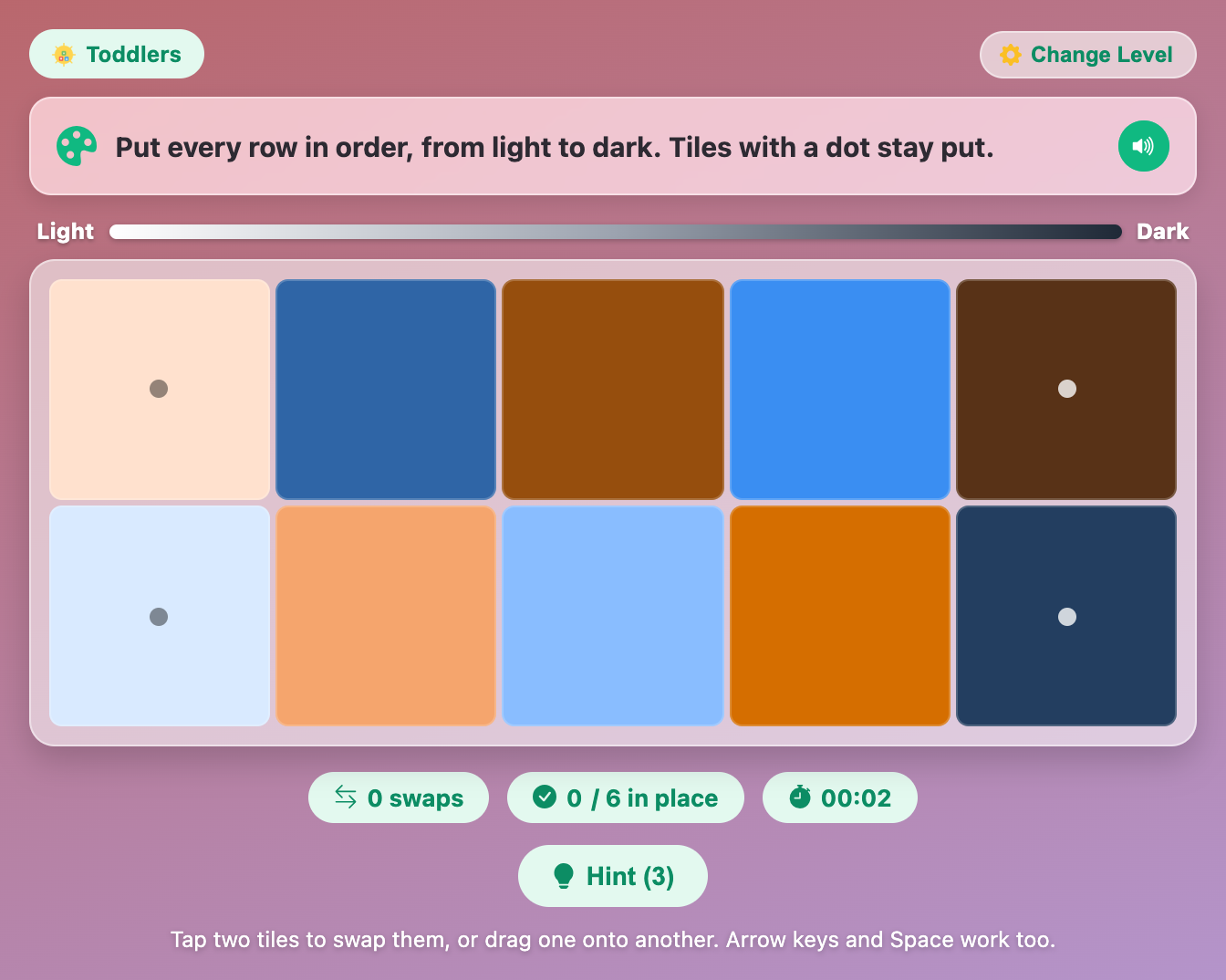 the same two rows shuffled in Rainbow Hue Sort, with blue and orange tiles mixed up and the dotted end tiles still in place