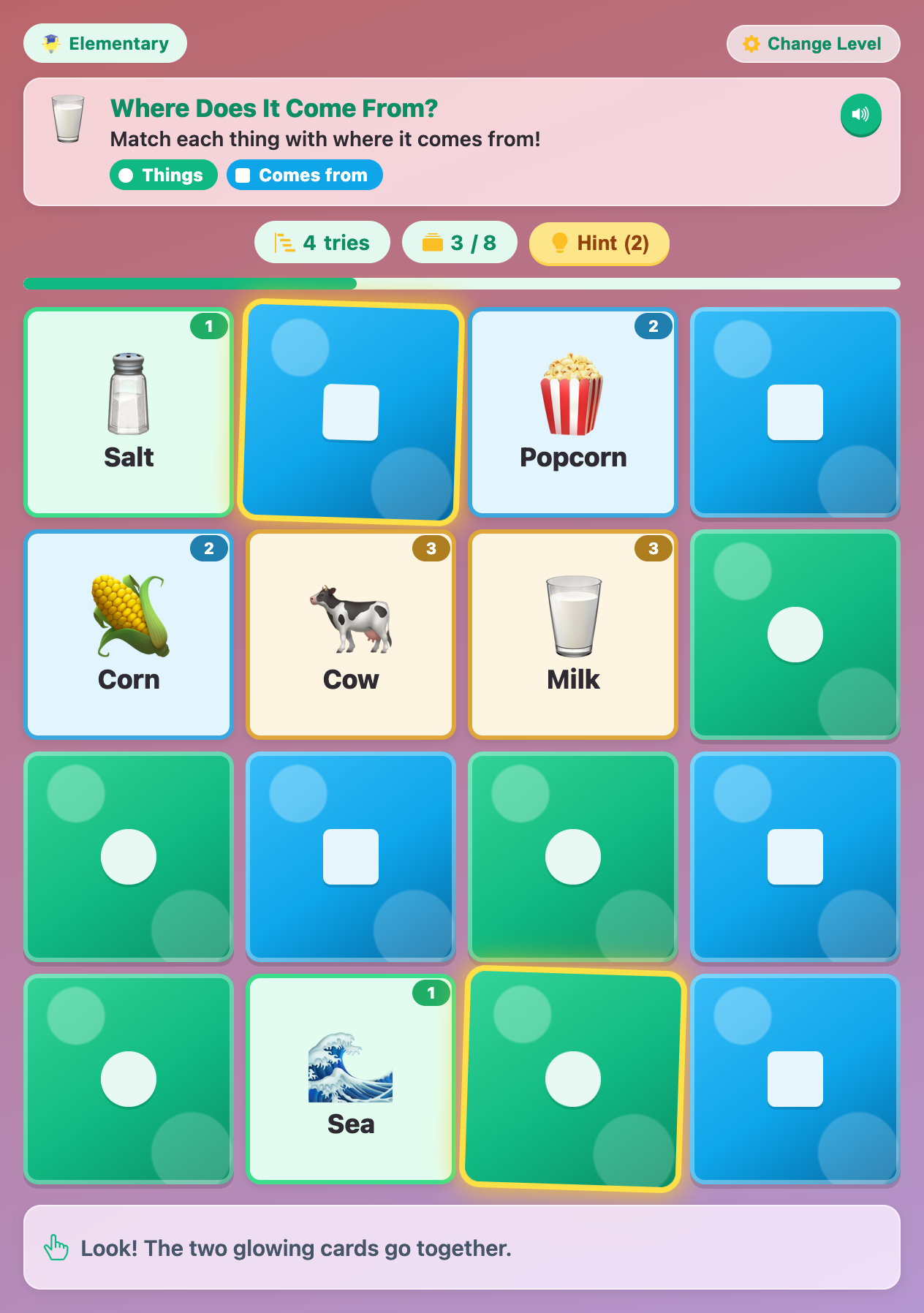 a hint making a blue card and a green card glow in Science Memory Match, with the tip Look! The two glowing cards go together.
